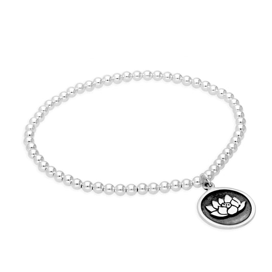Sterling Silver Stretchy 7 Inch Bead Bracelet with Round Lotus Charm