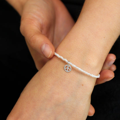 Sterling Silver & White Freshwater Pearl Bracelet with Peace Charm